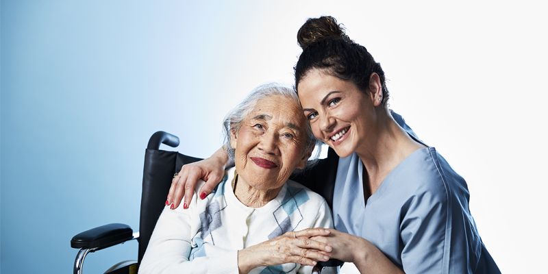 ComForCare - Caregiver and person in wheelchair