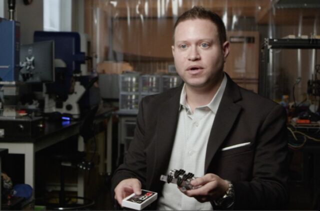 University of Maryland mechanical engineer Ryan D. Sochol shows off his team's soft robotic hand.