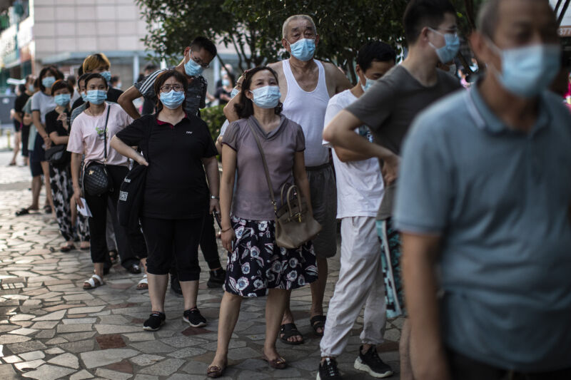 Residents line up for nucleic acid testing of COVID-19 on August 3, 2021, in Wuhan, Hubei Province, China. 