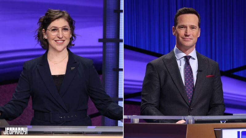 Mike Richards (right) will be the new regular host of <em>Jeopardy!</em> when it returns for its 38th season. <em>The Big Bang Theory</em> star Mayim Bialik will host "primetime and spinoff series." “><figcaption class=