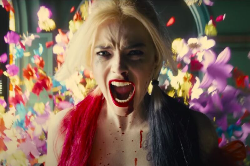 Don't call it a reboot: Margot Robbie stars in James Gunn's <em>The Suicide Squad</em>“><figcaption class=