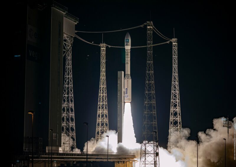 A rocket launches at night.