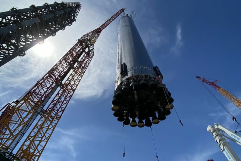 SpaceX's Booster 4 is lifted onto its orbital launch mount in South Texas.