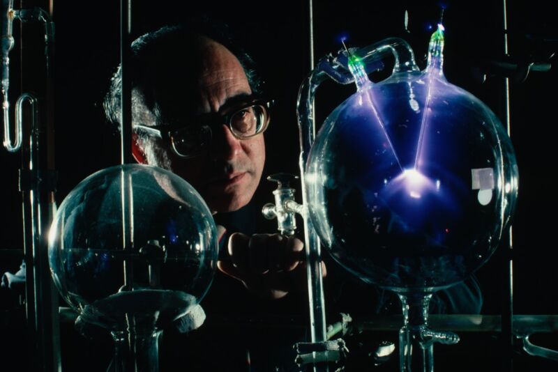 Stanley Miller with the original laboratory equipment used in the 1952 Miller-Urey Experiment, which gave credence to the idea that organic molecules could have been created by the conditions of the early Earth's atmosphere. 