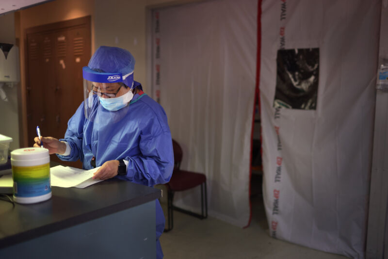 Intensive Care Unit nurse monitors patients in the ICU ward at Roseland Community Hospital on December 14, 2020, in Chicago, Illinois.