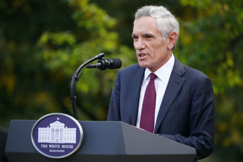 Image of a man speaking from behind a podium.