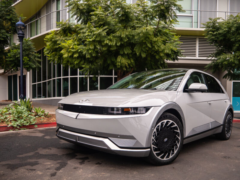 A cutting-edge electric car parked on a street.