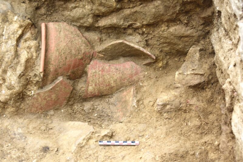 Rim fragments of a chamber pot being excavated at a Roman villa site in Sicily.