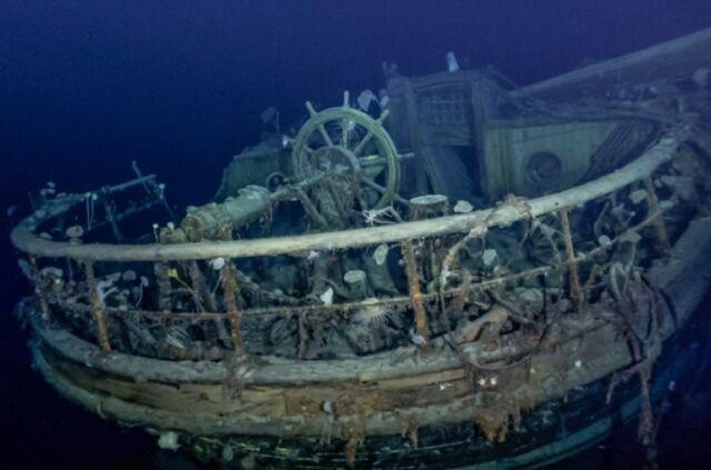 The rear deck and ship's wheel.