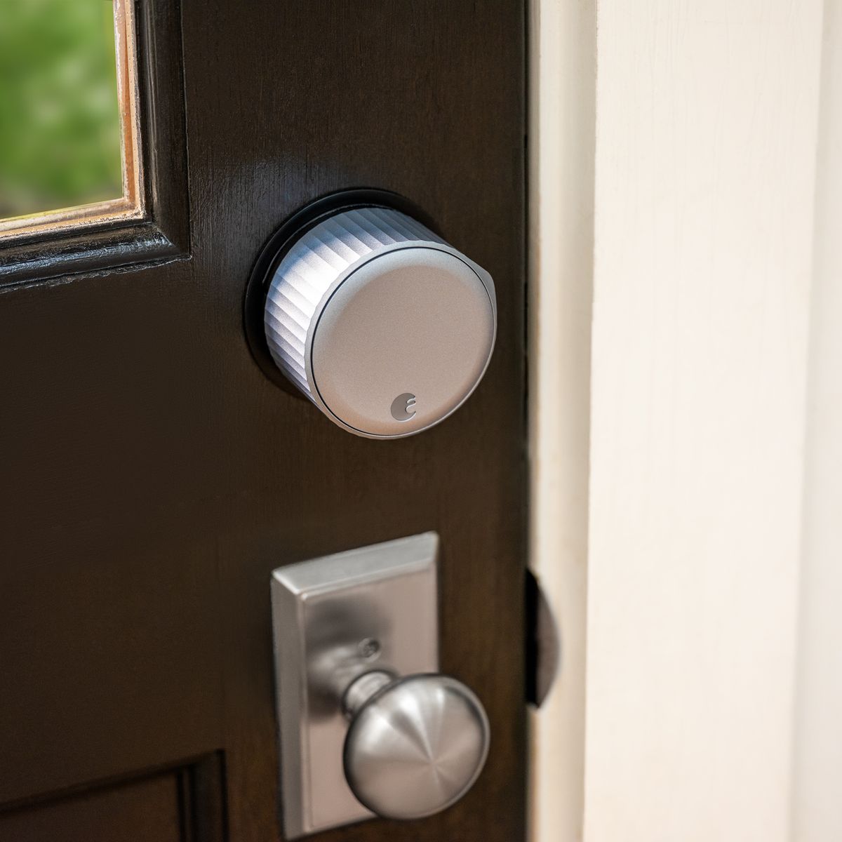 August Wi-Fi Smart Lock installed on a brown door