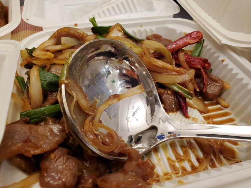 Stock photo of leftovers in a polystyrene container.