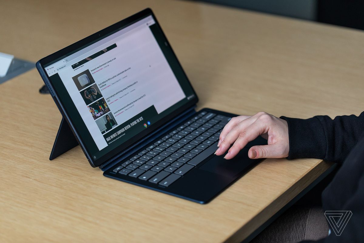 A user navigates on the Lenovo Chromebook Duet 5 in a conference room.