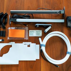 <em>Everything that comes in Govee’s DreamView kit, including the lights, camera, cables, adhesive clips, guides, and orange calibration foam.</em>“></noscript> </a> <span class=