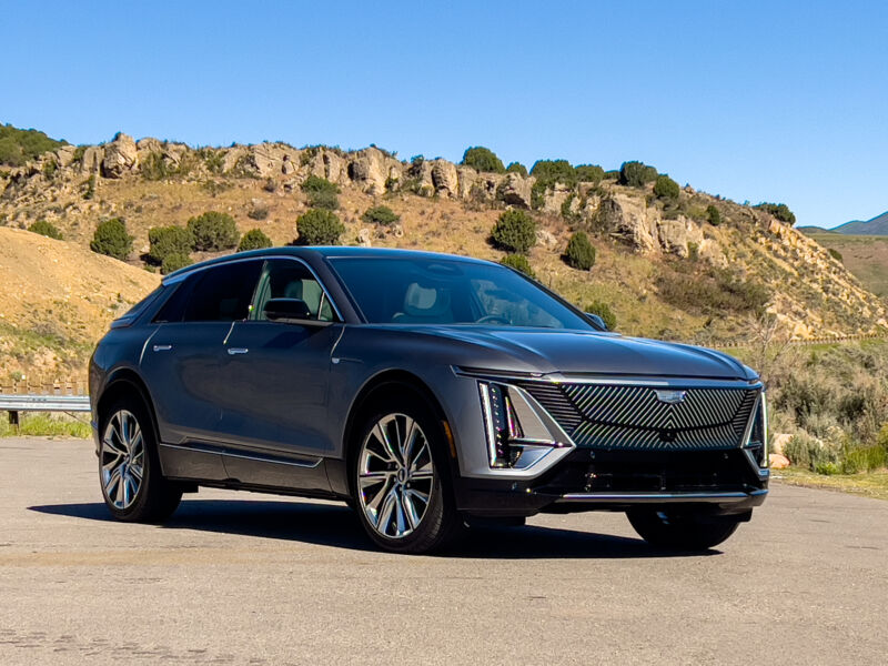 A Cadillac Lyriq parked in front of some of Utah's scenery.