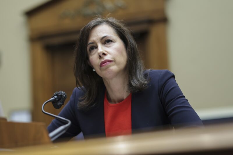 Federal Communications Commission Chairwoman Jessica Rosenworcel sitting at a table while answering questions at a Congressional hearing.