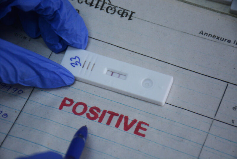 MUMBAI, INDIA JUNE 7: A health worker collects swab samples of a citizen for Covid-19 test after cases are on the rise in the city, at TMC's C.R. Wadia Hospital testing centre, in Thane, on June 7, 2022 in Mumbai, India. 