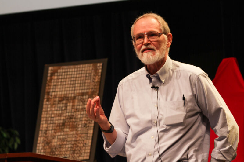 Brian Kernighan speaking onstage.