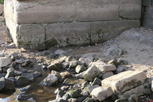 Hunger stone at Dresden-Pillnitz, near the stairs of Pillnitz Castle's western sphinx. Inscriptions record droughts in the years 1778, 1893, 1904, 2003, 2018.