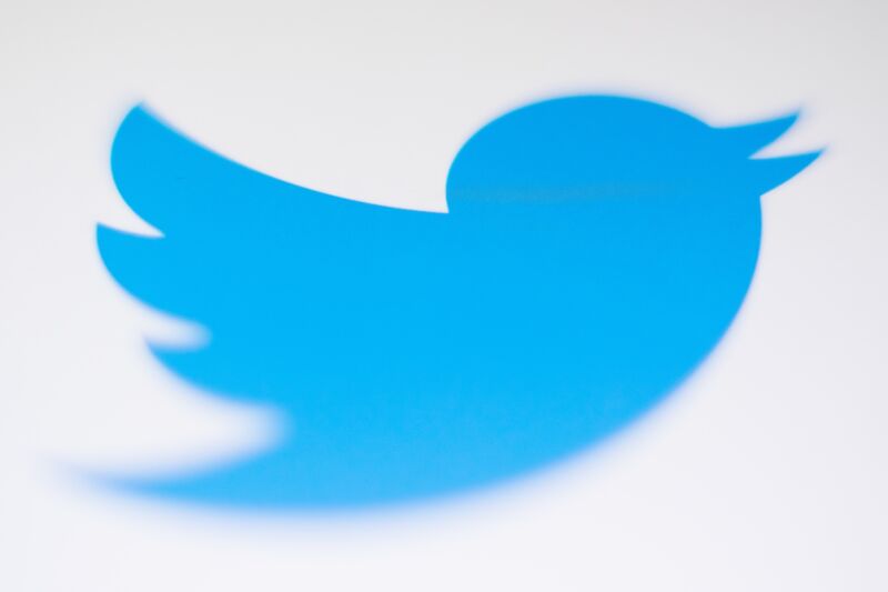 Closeup shot of a Twitter logo seen displayed on a smartphone screen.