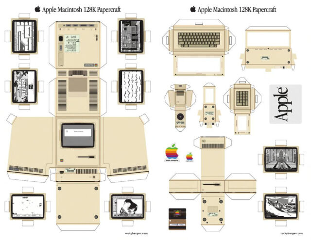 A vintage Mac 128K papercraft model designed by Rocky Bergen, complete with accessories.