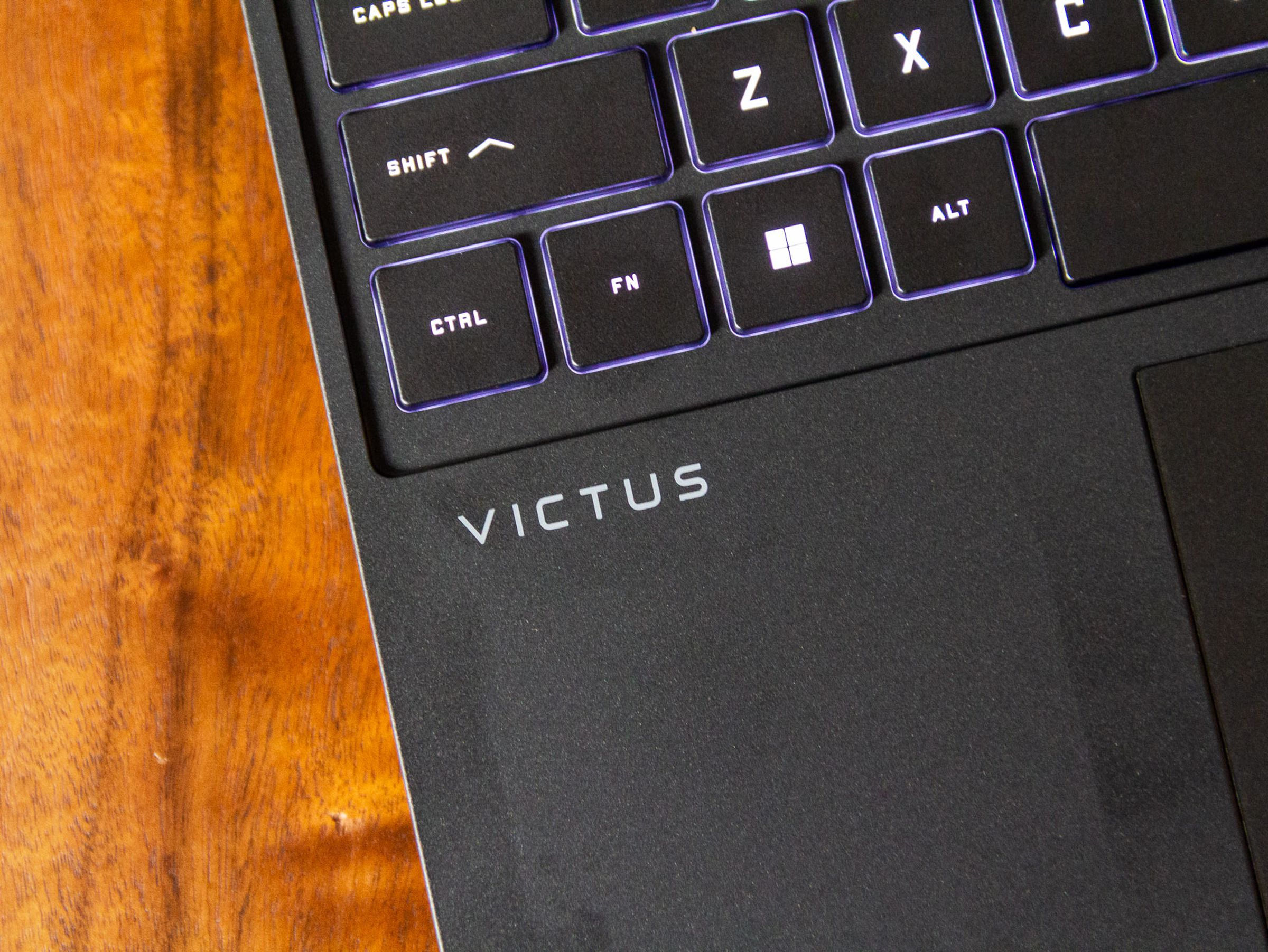 The Victus logo on the keyboard deck of the HP Victus 15.