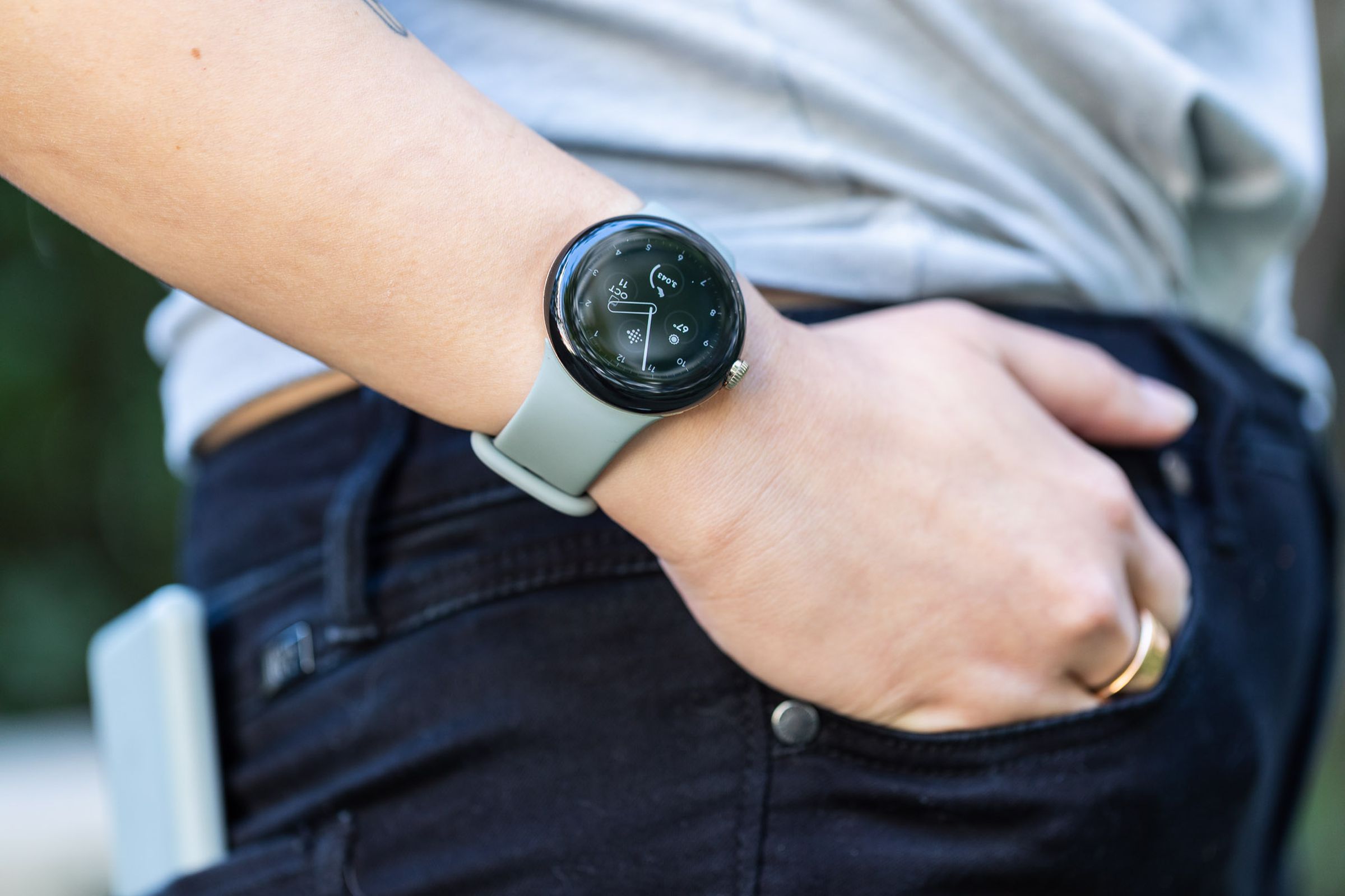 Woman with hand in pocket wearing Pixel Watch