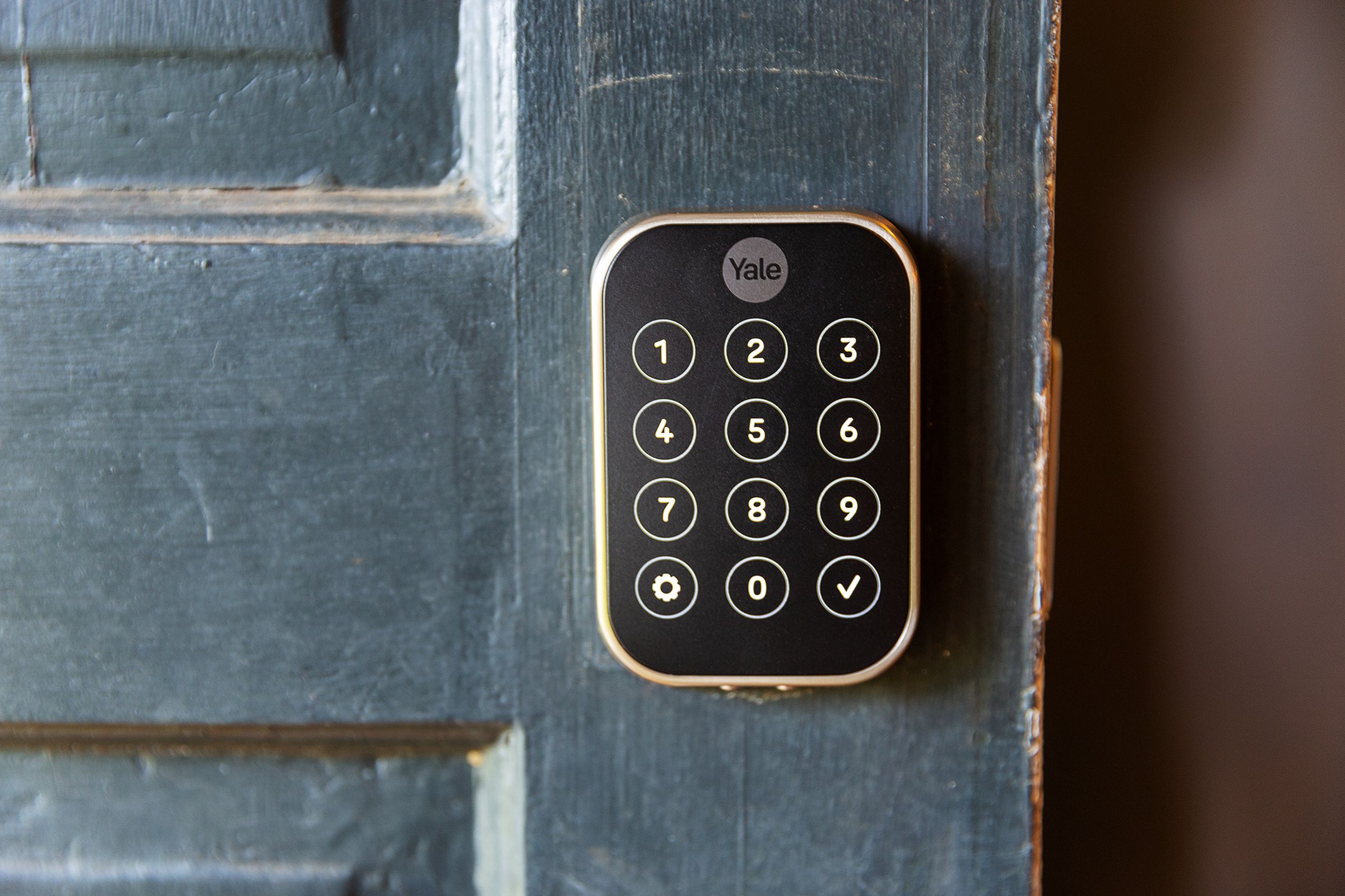 A touchscreen keypad on a door.