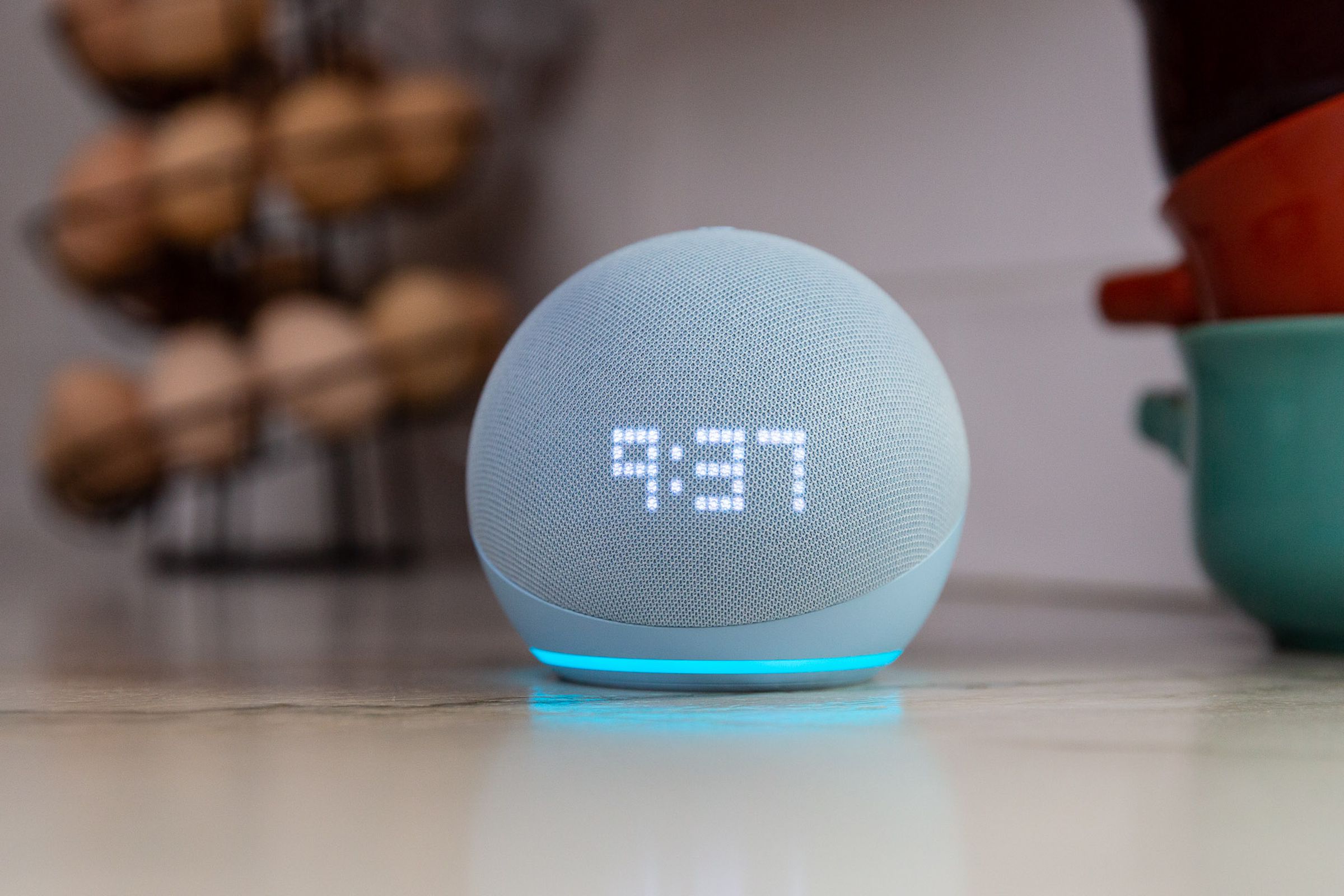 An Echo Dot with Clock on a counter