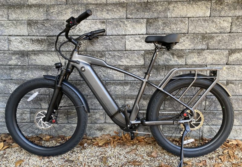 Image of an e-bike leaned against a wall.