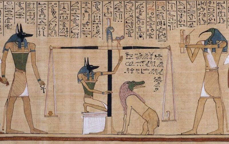 Sample illustration from an Egyptian <em>Book of the Dead</em>—not the newly discovered papyrus—depicting the "weighing of the heart."”><figcaption class=