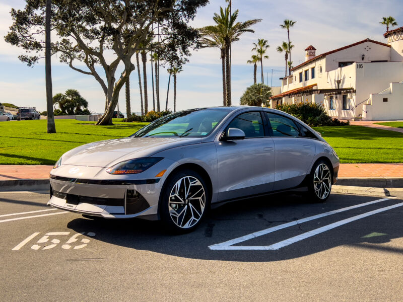 A Hyundai Ioniq 6 parked by some trees