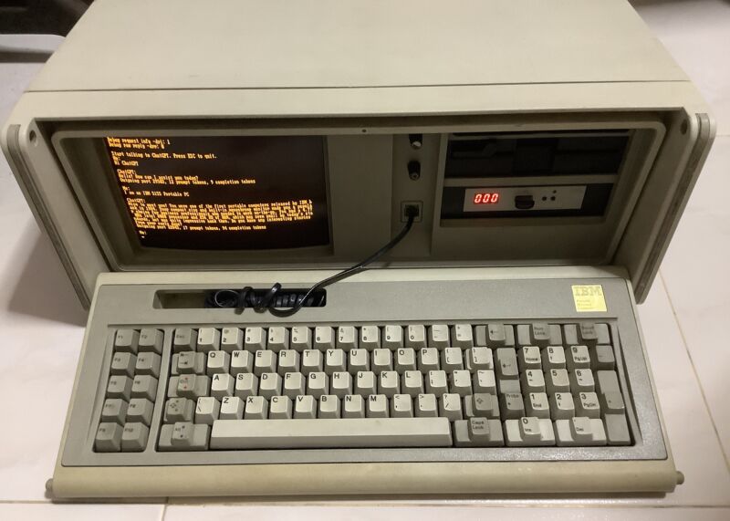 A photo of an IBM PC 5155 computer running a ChatGPT client written by Yeo Kheng Meng.