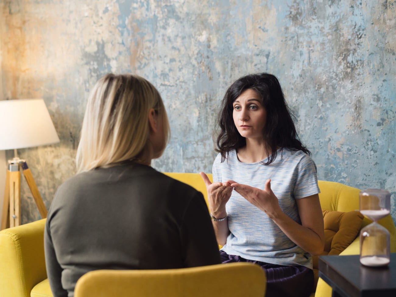 Woman psychologist talking to patient