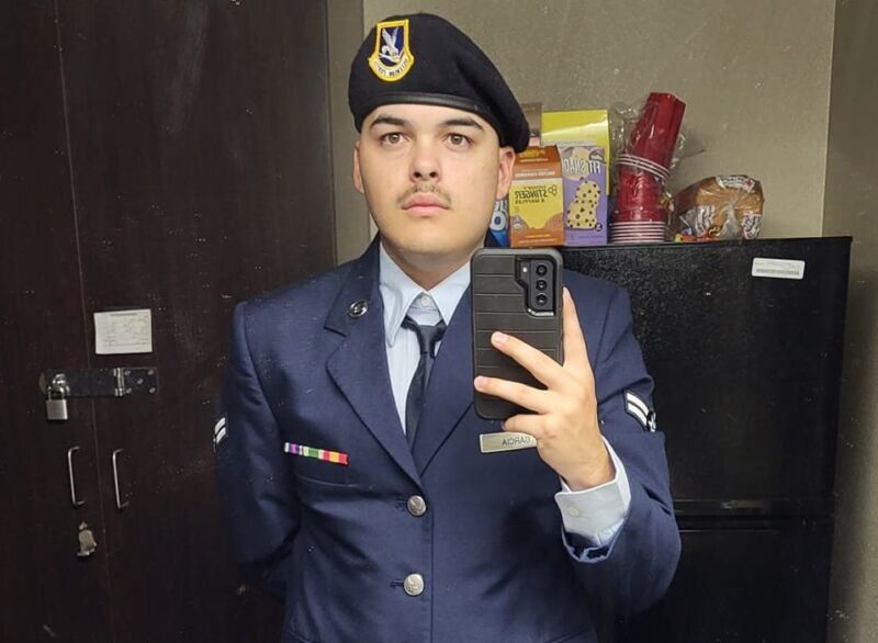 Selfie photo of a young man in a military uniform.