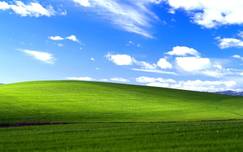 With this background, potentially <a href="https://en.wikipedia.org/wiki/Bliss_(image)">the most viewed photograph in human history</a>, Windows XP always signaled that it was prepared for a peaceful retirement. Yet some would have us disturb it.”><figcaption class=