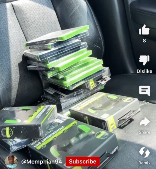 A pile of <em>Starfield</em> discs sits on a car seat in a video posted by Harris. “><figcaption class=