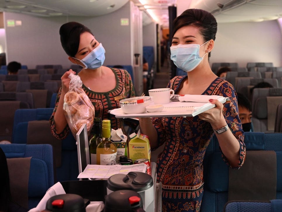 Flight attendants wearing masks.