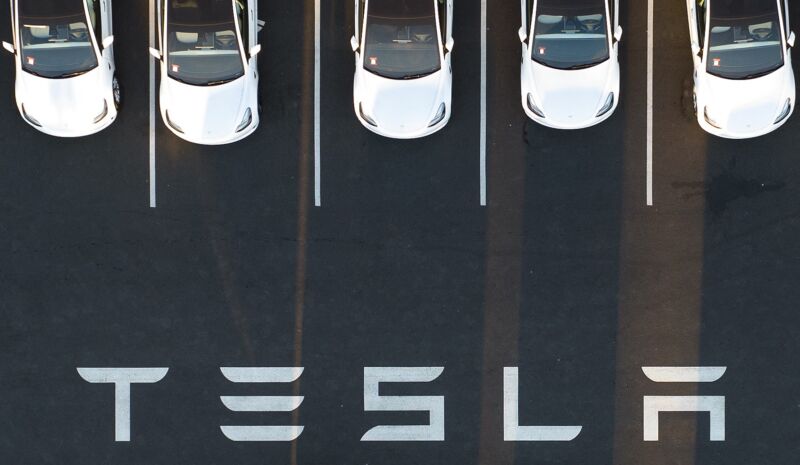 Aerial view shows cars parked at the Tesla factory in Fremont, California.