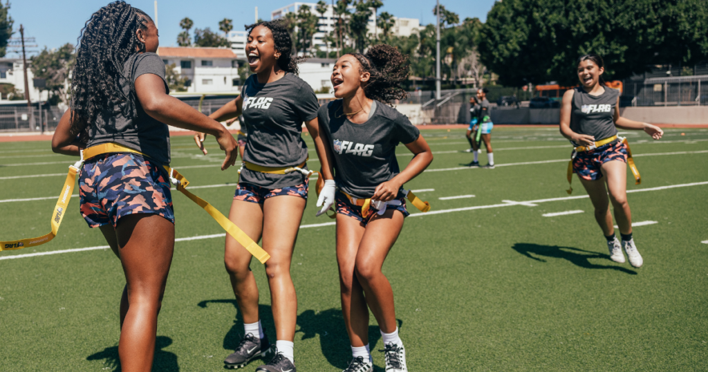 NFL FLAG football players celebrate after a play