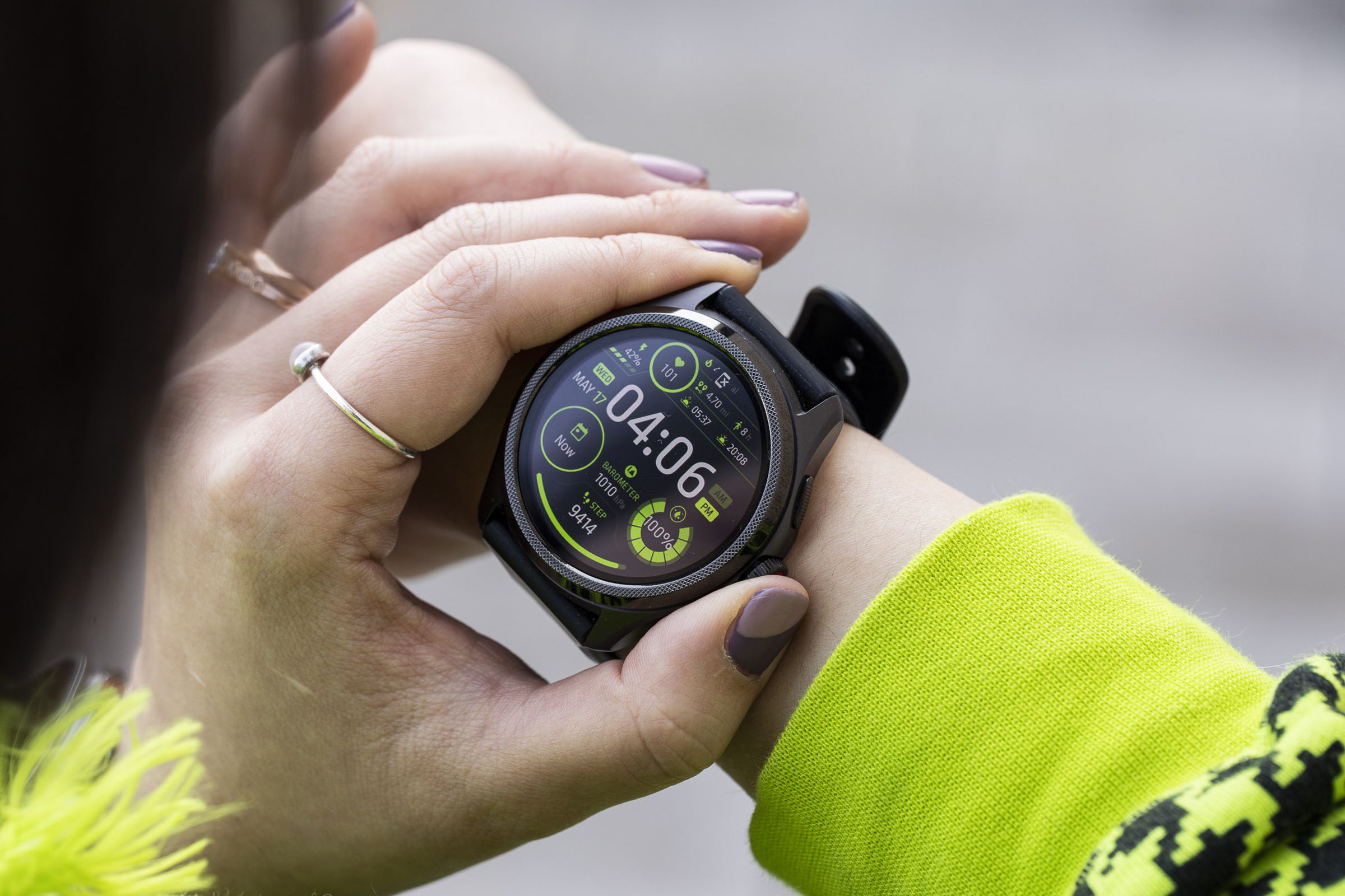 Close-up of person pressing the TicWatch Pro 5’s digital crown