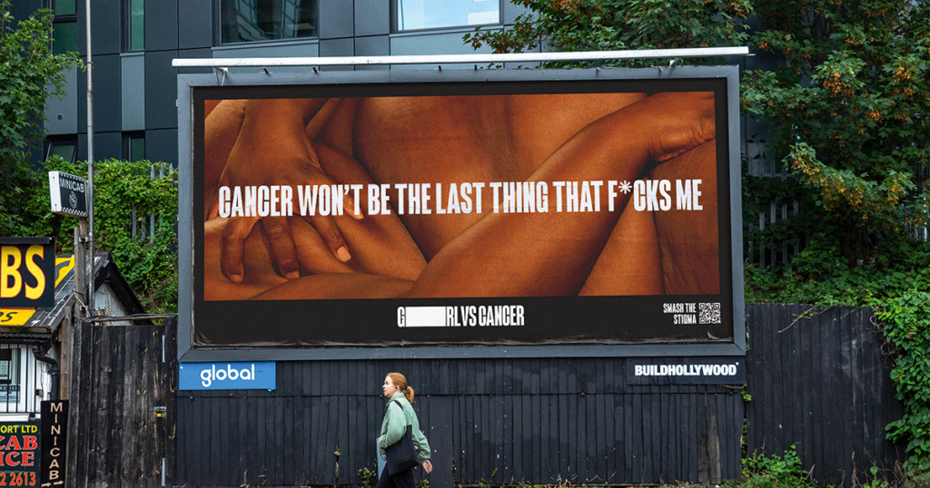 GIRLvsCANCER billboard showing a naked body and the text "cancer won't be the last thing that f*cks me"