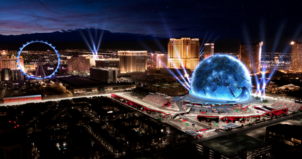 An aerial view of the MSG Sphere and the Las Vegas Strip at night