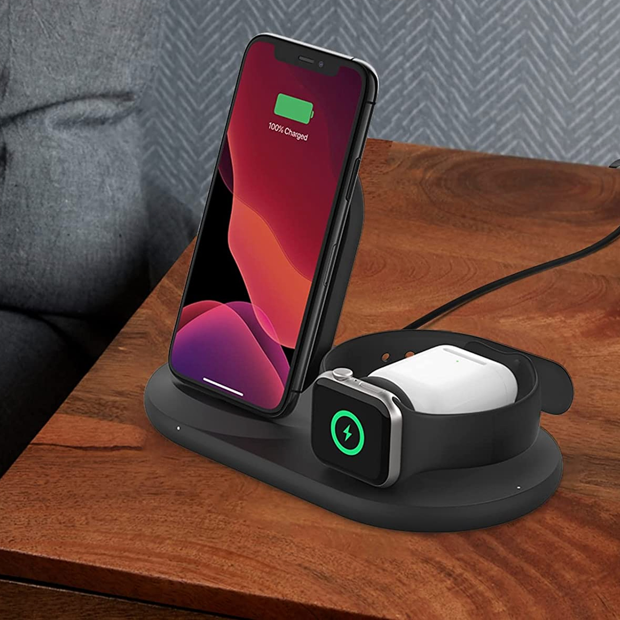 Apple phone and watch on charging stand