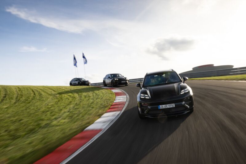 Three prototype Macans drive on a test track