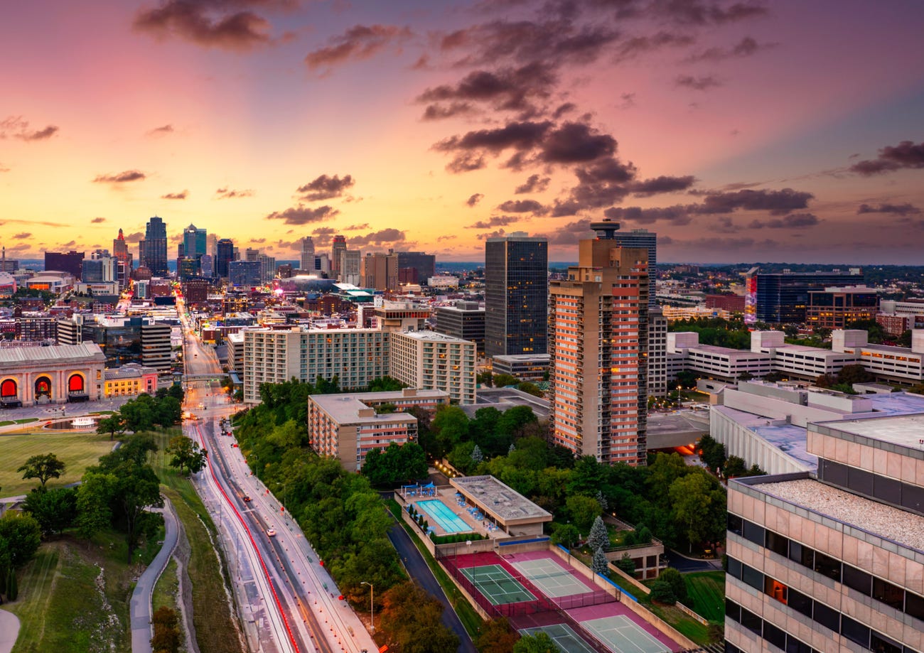 Aerial view of Kansas City skyline at dusk, viewed from Penn Valley Park.