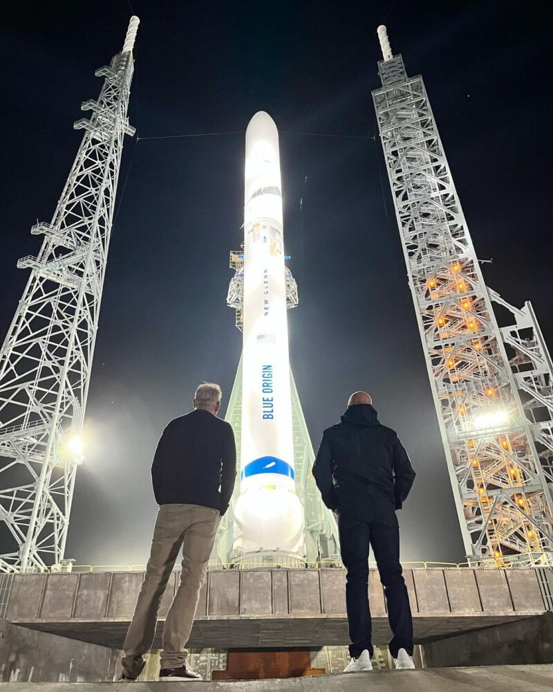 Dave Limp, Blue Origin's new CEO, and founder Jeff Bezos observe the New Glenn rocket on its launch pad Wednesday at Cape Canaveral Space Force Station, Florida.