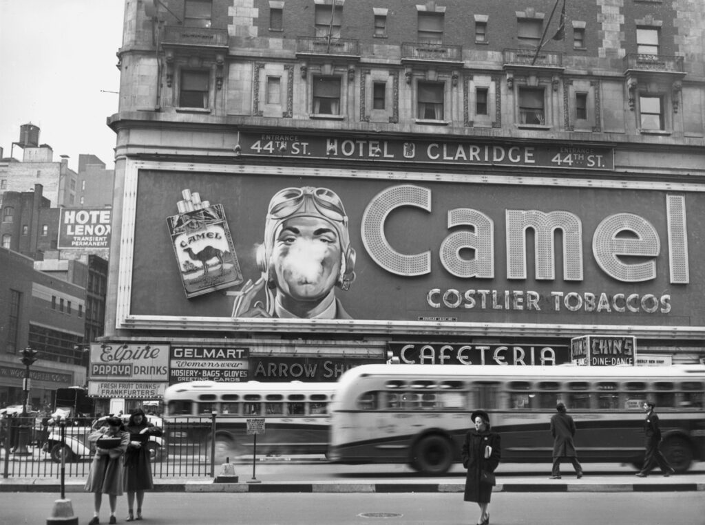 camel's smoking man billboard with a smoker seeming yo breathe out smoke