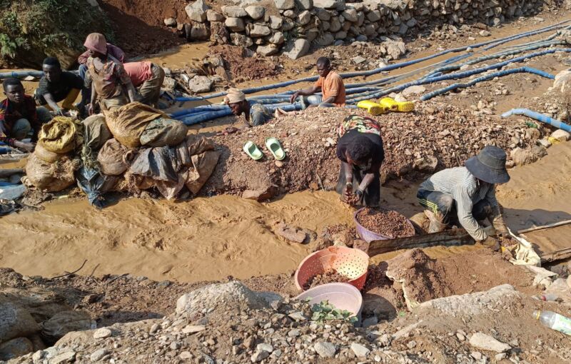 Workers laboring outdoors at a cobalt mine in the Democratic Republic of the Congo