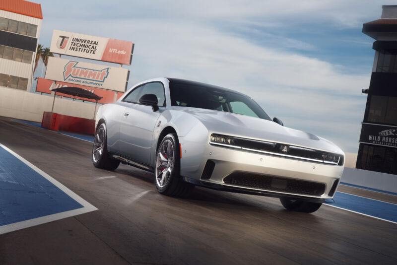 A rendering of a silver Dodge Charger Daytona Scat Pack EV at the drag strip