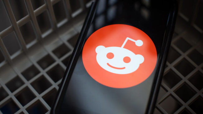 the reddit alien logo over a keyboard